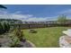 Well-maintained backyard with stone fire pit, lush lawn, and privacy fence at 234 Basket Grass Ln, Summerville, SC 29486