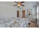 Bright bedroom with a ceiling fan, dresser, mirror and neutral colored walls and carpet at 234 Basket Grass Ln, Summerville, SC 29486