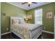 Cozy bedroom with a comfortable bed, ceiling fan, and natural light from the window at 234 Basket Grass Ln, Summerville, SC 29486
