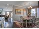 Open dining area with nice decor, hardwood floors, and connection to the living room at 234 Basket Grass Ln, Summerville, SC 29486