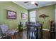 Dining room with modern table, wooden chairs, nice decor and lots of sunlight at 234 Basket Grass Ln, Summerville, SC 29486