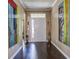 Welcoming entryway with hardwood floors and decorative artwork on the walls at 234 Basket Grass Ln, Summerville, SC 29486