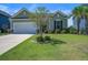 Charming single-story home with well-maintained lawn and flowering tree in a Gathering-friendly neighborhood at 234 Basket Grass Ln, Summerville, SC 29486