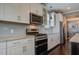 Updated kitchen with stainless steel appliances, granite countertops, modern backsplash, and plenty of cabinets at 234 Basket Grass Ln, Summerville, SC 29486