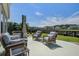 Cozy patio area featuring comfortable seating, a hot tub, and well-manicured landscaping at 234 Basket Grass Ln, Summerville, SC 29486