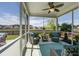 Relaxing screened-in porch with comfortable seating and views of the fenced backyard at 234 Basket Grass Ln, Summerville, SC 29486