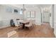 Elegant dining room featuring hardwood floors, wainscoting, and modern chandelier lighting at 238 Silk Oak Dr, Moncks Corner, SC 29461
