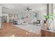 Spacious living room with ample natural light, hardwood floors, and an open layout to the kitchen at 238 Silk Oak Dr, Moncks Corner, SC 29461