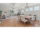 Bright, open-concept living room and dining area with hardwood floors and a cozy fireplace at 238 Silk Oak Dr, Moncks Corner, SC 29461