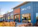 Modern donut shop exterior with large windows and outdoor seating under a bright, clear sky at 240 Somerset Acres Dr, Summerville, SC 29486