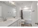 Bathroom with double vanity, white cabinets and shower-tub combo at 306 Lucca Dr, Summerville, SC 29486