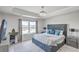 Primary bedroom featuring tray ceiling, chandelier and an exterior view of a pond at 306 Lucca Dr, Summerville, SC 29486