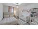 Bedroom with a bed, crib, and bookshelves at 306 Lucca Dr, Summerville, SC 29486