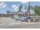 Exterior view of a Chick-fil-A restaurant with ample parking, lush landscaping, and American flag at 306 Lucca Dr, Summerville, SC 29486