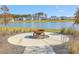 Community fire pit overlooking the water, a great place to relax with neighbors and enjoy the natural scenery at 306 Lucca Dr, Summerville, SC 29486