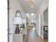 Bright hallway with hardwood floors, modern decor, and a view into the living area at 306 Lucca Dr, Summerville, SC 29486