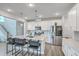 Modern kitchen with stainless steel appliances, a large island, and stylish bar stools at 306 Lucca Dr, Summerville, SC 29486