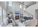 Bright, airy living room with fireplace, staircase and vaulted ceiling at 306 Lucca Dr, Summerville, SC 29486