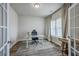 Well-lit home office with a modern desk, comfortable chair, and stylish decor at 306 Lucca Dr, Summerville, SC 29486