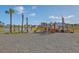 A wooden playground and swing set for with a view of the nearby pond at 306 Lucca Dr, Summerville, SC 29486