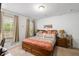 Bedroom with window, plush bed, and side tables at 3121 Harding Ct, Johns Island, SC 29455
