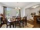 Dining room with wood table and chairs, and a bright window at 3121 Harding Ct, Johns Island, SC 29455