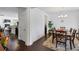 Open-concept dining room with wood floors and views of other rooms at 3121 Harding Ct, Johns Island, SC 29455