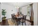 Bright dining room featuring a wooden table, stylish chairs, and natural light from the windows at 3121 Harding Ct, Johns Island, SC 29455