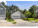 Charming white single-Gathering home features a two-car garage and well-manicured landscaping at 3121 Harding Ct, Johns Island, SC 29455