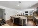Open-concept kitchen flowing into the living area, featuring an island and modern appliances at 3121 Harding Ct, Johns Island, SC 29455