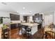 Well-lit kitchen with a large island, granite countertops, and sleek dark cabinets at 3121 Harding Ct, Johns Island, SC 29455