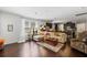 Open living space with hardwood floors, large windows, and seamless flow into the kitchen at 3121 Harding Ct, Johns Island, SC 29455