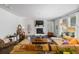 Inviting living room with a cozy fireplace, ample natural light, and comfortable furniture at 3121 Harding Ct, Johns Island, SC 29455