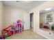 Versatile room with neutral walls, tiled floor, and a large mirror at 317 Dorchester Manor Blvd, North Charleston, SC 29420