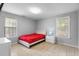 Neutral bedroom with a bed, two windows, and a nightstand for convenience at 317 Dorchester Manor Blvd, North Charleston, SC 29420