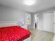 Bedroom with red and white polka dot bedspread, closet, and good natural light at 317 Dorchester Manor Blvd, North Charleston, SC 29420