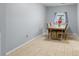 Simple dining area with a wooden table, upholstered chairs, and tiled floor at 317 Dorchester Manor Blvd, North Charleston, SC 29420
