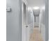 Well-lit hallway with neutral walls and tiled floor leads to other rooms at 317 Dorchester Manor Blvd, North Charleston, SC 29420