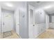 Bright and welcoming hallway with a tiled floor, connecting various rooms at 317 Dorchester Manor Blvd, North Charleston, SC 29420