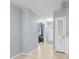 Bright hallway with tiled floor, paneled walls, and access to the living area at 317 Dorchester Manor Blvd, North Charleston, SC 29420
