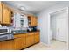 Kitchen with ample cabinets and sink beneath a window. Laundry access is visible at 317 Dorchester Manor Blvd, North Charleston, SC 29420