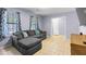 Cozy living room featuring a comfortable gray sectional sofa and tiled flooring at 317 Dorchester Manor Blvd, North Charleston, SC 29420