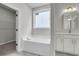 Bright bathroom features soaking tub, vanity with mirror, and walk-in closet at 319 Abercom Place Dr, Moncks Corner, SC 29461