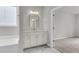 Bathroom vanity with quartz countertops, modern fixtures, and stylish gold-trimmed mirror at 319 Abercom Place Dr, Moncks Corner, SC 29461