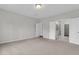 Spacious bedroom features neutral carpet, recessed lighting, and ensuite bathroom access at 319 Abercom Place Dr, Moncks Corner, SC 29461