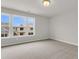 Bright bedroom with large windows offers natural light and neighborhood views at 319 Abercom Place Dr, Moncks Corner, SC 29461