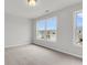 Bright bedroom with large windows offering views of the surrounding neighborhood at 319 Abercom Place Dr, Moncks Corner, SC 29461