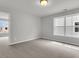 Bedroom features new windows allowing for ample natural light and new carpet at 319 Abercom Place Dr, Moncks Corner, SC 29461