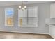 Bright dining area features natural light, modern lighting, and hardwood floors at 319 Abercom Place Dr, Moncks Corner, SC 29461