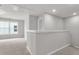 Upstairs hallway features neutral walls, carpeting, and natural light from nearby window at 319 Abercom Place Dr, Moncks Corner, SC 29461